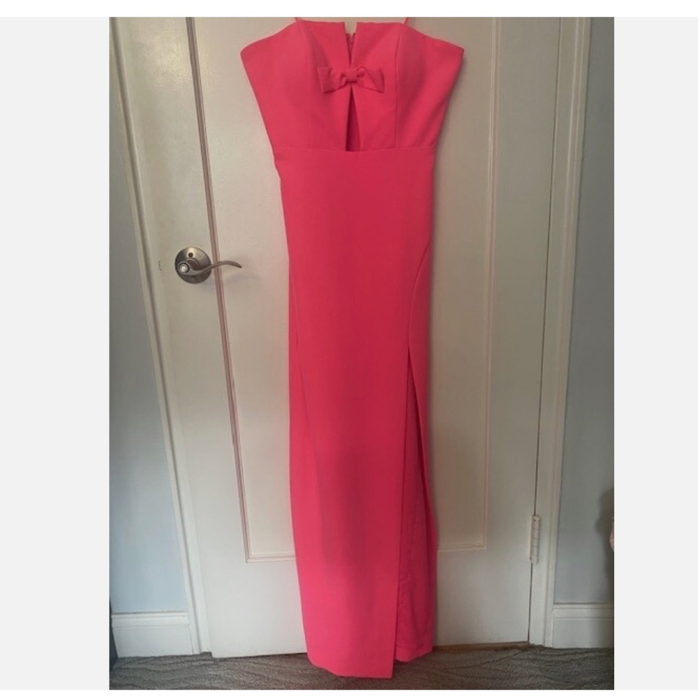 Neon pink strapless bridesmaid or wedding guest dress